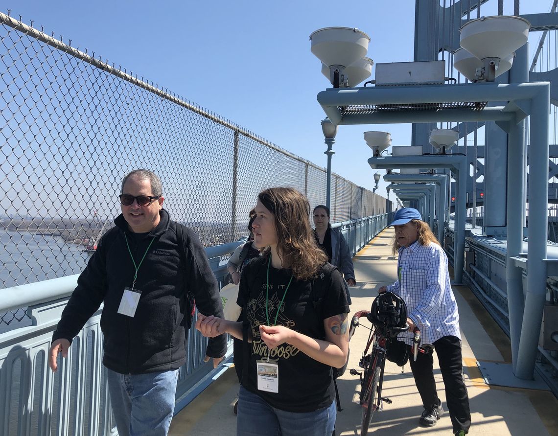 John Boyle, research director for Bicycle Coalition of Greater Philadelphia, and Sonia Szczesna, South Jersey program coordinator for the Tri-State Transportation Campaign, led a dozen walkers from the Camden Waterfront across the Ben Franklin Bridge to Philadelphia on Saturday morning.